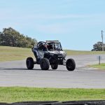 The JSR Performance UTV drives around the corner of the track with no other UTVs in sight